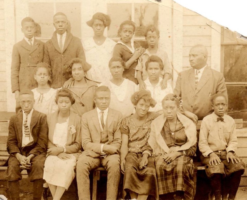 J.K. Hughes with students at the Franklin Training School.