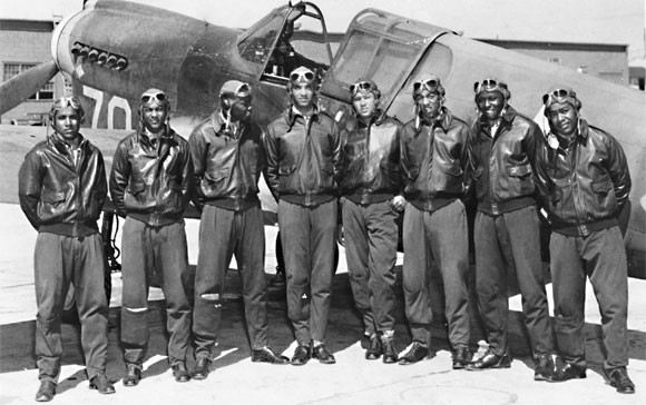 A group of Tuskegee Airmen poses for a photo.