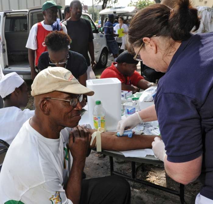 Photo Credit: Bob Mack/The Times-Union. County Health Department Set up tuberculosis screening station behind Clara White Mission downtown.