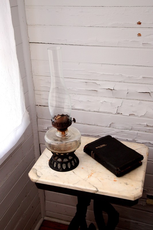 Lantern and Bible on Marbletop table