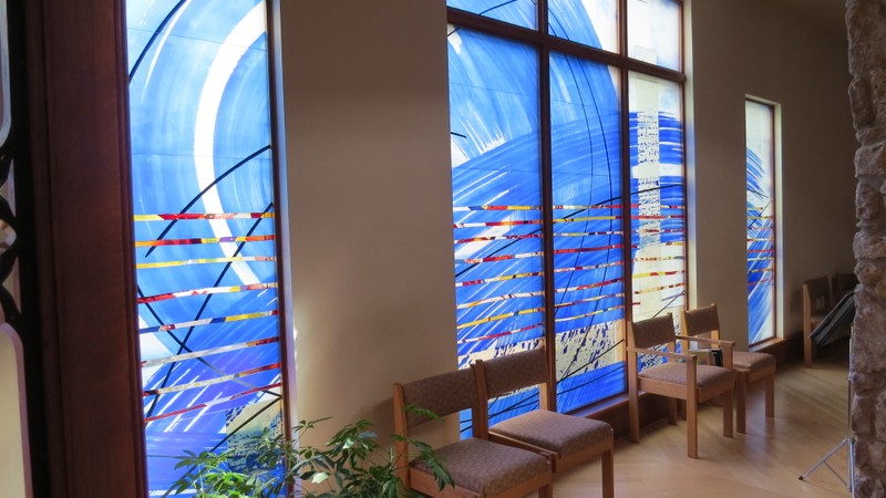 The blue glass windows representing the spring waters which flow throughout the property.