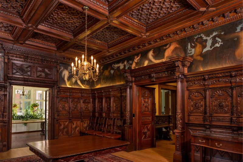 The interior features ornate woodwork.