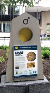 The Sagan Planet Walk was built in 1997 by the Sciencenter. Each marker features an interpretive sign, such as this one for the planet Mars.