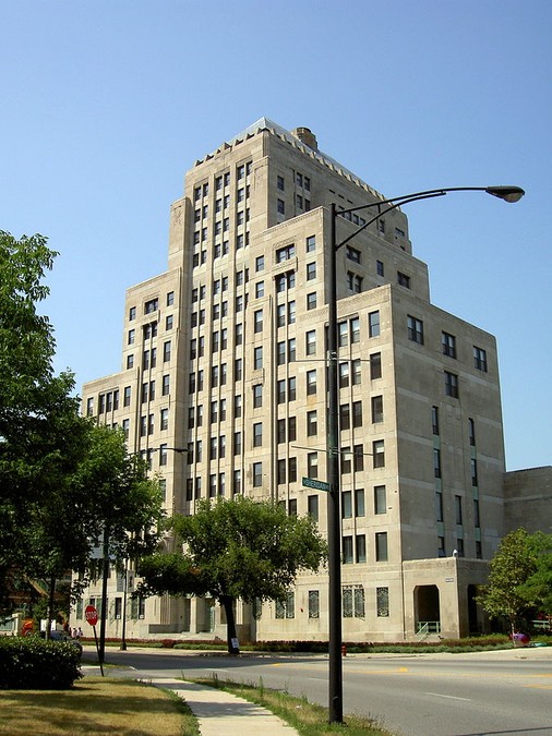 Looking northwest at Mundelein Center from Sheridan, where the road transitions from a north-south road to an east-west road. The building is located at the corner, and thus easily seen by travelers.