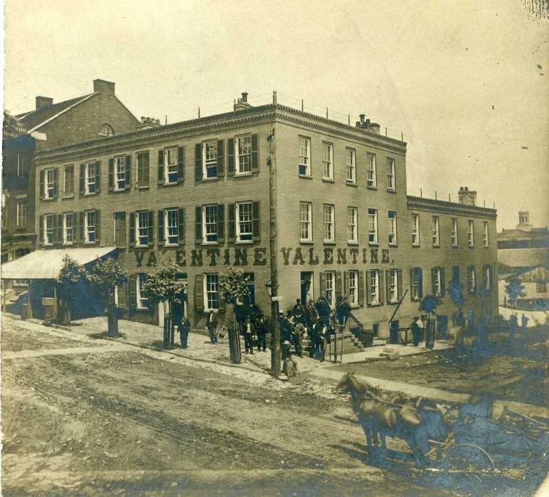 This picture was taken after the three story building was constructed and before it burned down in 1899.