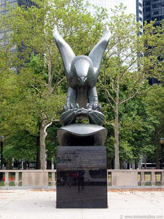 The center of the monument features a bronze eagle by sculptor Albino Manca