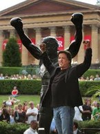 Actor Sylvester Stallone in front of the Rocky Sculpture.