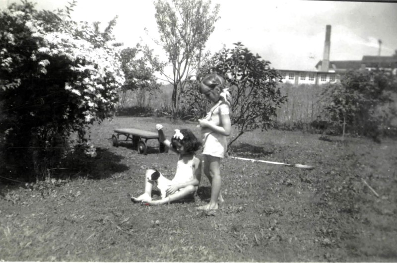 Jan and Joyce Ammons playing in E-15 yard near garden