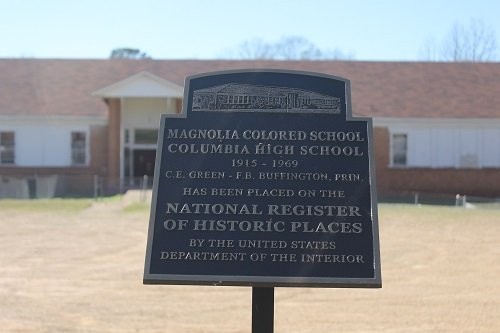 National Register info marker with school in the background.