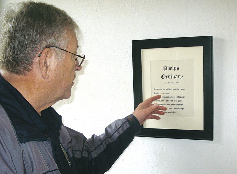 Paul Bibbee of the Wood County Historical and Preservation Society reads the order establishing the prices Hugh Phelps could charge at his tavern, the first “ordinary” in Wood County