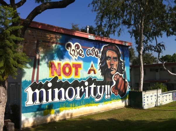 One of the notable murals from the Estrada Courts Projects stating, "We are Not a Minority!!"