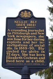 Nellie Bly's historical marker was erected in 1995. It honors Nellie Bly, the journalist known for traveling the entire world in 72 days, and her undercover stunts to expose social justice issues. The marker stands in front of Bly's childhood home in