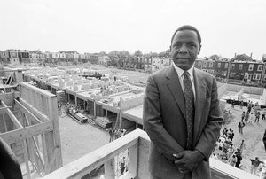 Mayor Wilson Goode Stands on the Roof of One of the Rebuilt Homes