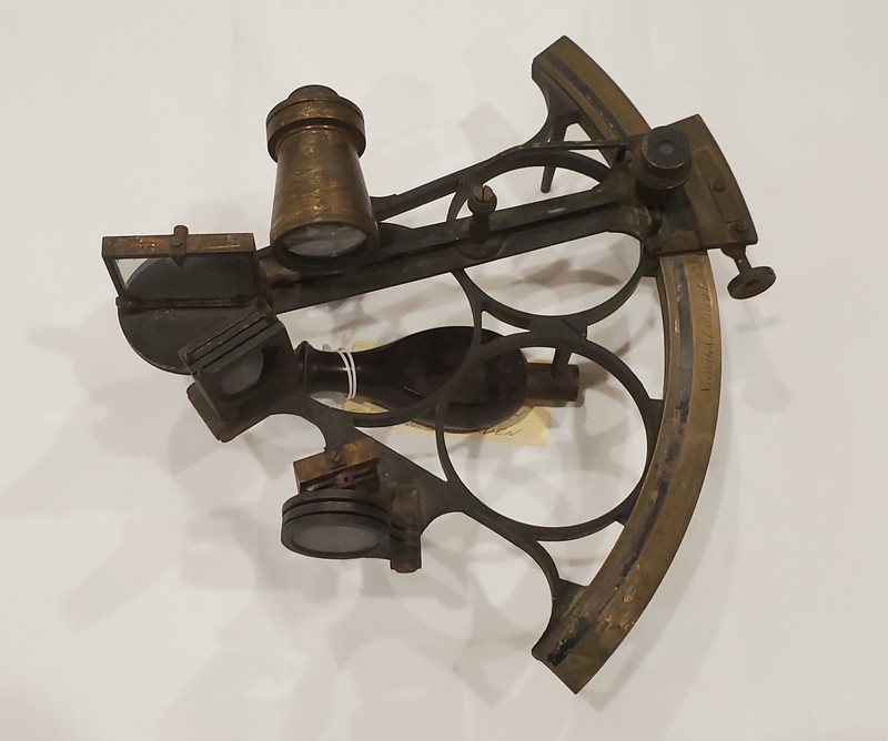 A sextant is a navigational tool that is used to pinpoint a ship’s location. It measures the angle from the horizon to the sun, moon, or a star. That information, along with the time of day, can be referenced in published tables to determine a ship’s latitude.  The sextant is so named because its arc spans 60 degrees, or one sixth of a circle.