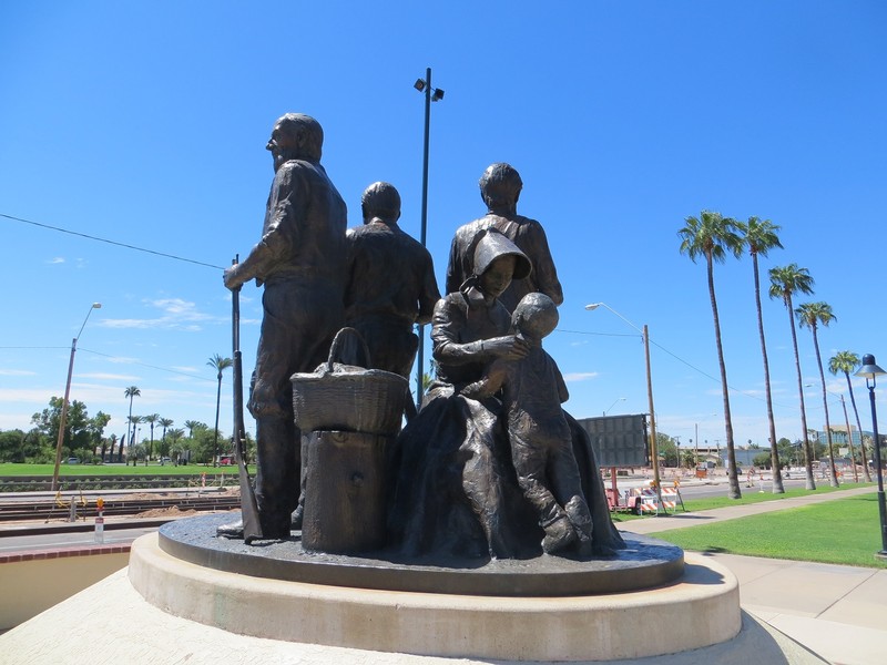 A pioneer mother and her son are seated behind the town's founding fathers. Photograph by Cynthia Prescott.