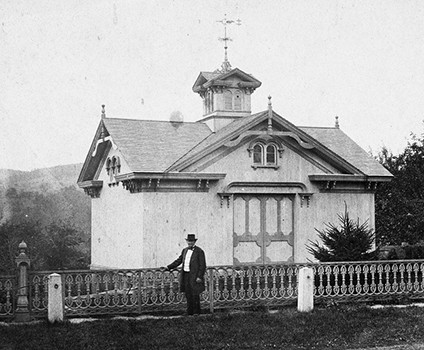 This photo shows John T. Andrew in front of the building.