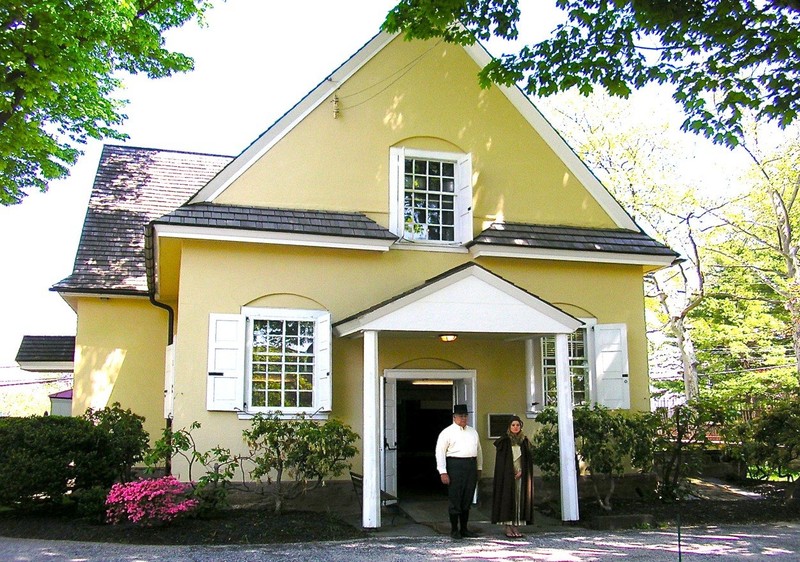 Period actors stand in front of the meeting house during its 2018 history festival.  