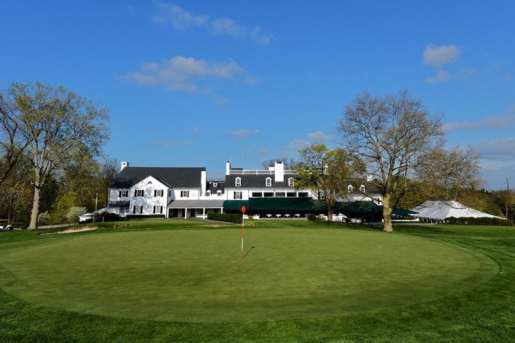 Merion's clubhouse sits behind its 18th green.  