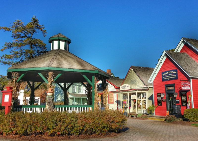 This image shows the heart of one side of the town, where the local shops all face toward a quaint gazebo. Photo from historicsmithville.com.