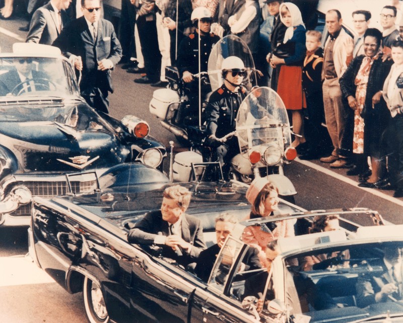 President Kennedy and the first lady riding through Dealey Plaza just minutes before the gun shot. 