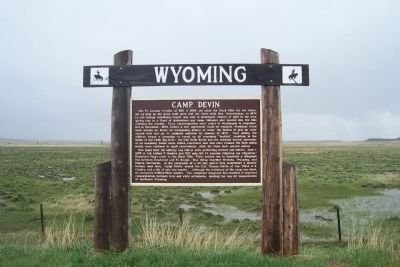 The marker of Camp Devin located of the highway to the right when traveling north on WY-112 N