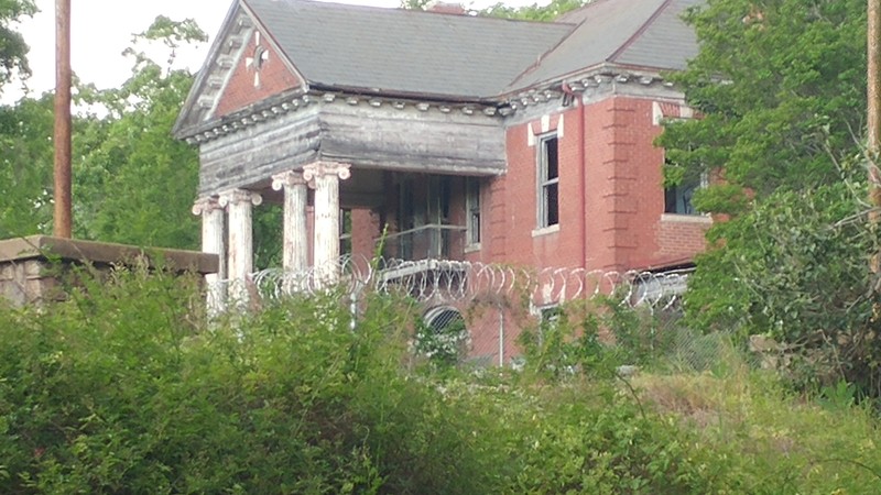 The old 1910 main administration office building now fenced up