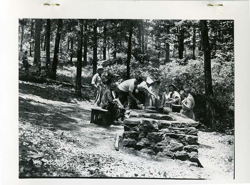 The Civilian Conservation Corps building a structure.

