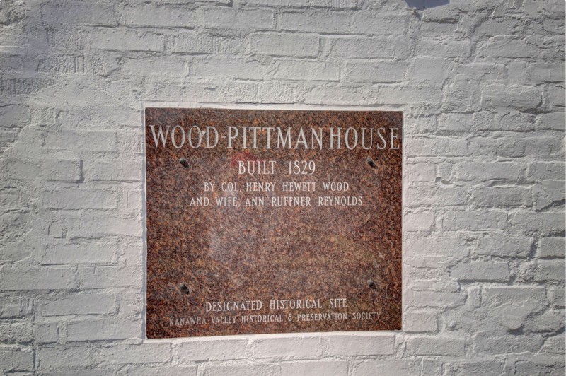 Plaque noting the historical significance of the house