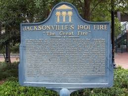 Plaque for the Great Fire of 1901. " On May 3, 1901 at 12:30 p.m., a fire began at the Cleaveland Fibre Factory, ten blocks northwest of this site. Chimney embers ignited sun-dried moss to be used as mattress stuffing. Fueled by wind and dry weather, the fire roared east destroying most structures in its path. By 3:30 p.m., the fire reached this site, then called Hemming Park. The park and its renowned live oaks were devoured by the flames and only the Confederate Monument survived, its base glowing red from heat. The fire continued an eastward march to Hogan's Creek, where a citizens'? bucket brigade stayed the flames. Then, turning south, the inferno roared to Bay Street's riverfront docks. Extreme heat caused a waterspout in the river where rescue boats trolled for survivors. The fire was so intense, Black smoke clouds could be seen as far away as South Carolina. As flames moved west on Bay Street, the firefighters? gallant stand and dying winds brought the fire under control by 8:30 p.m. In just eight hours, nearly 10,000 people were homeless, 2,368 buildings were lost, 146 city blocks were destroyed, but miraculously only seven people perished. Jacksonville's 1901 Fire remains the most destructive burning of a Southern city in U.S. history."