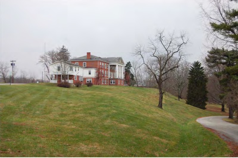 The main building and an adjacent residence at the former home before its demolition