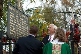 Businessmen celebrating The Old Episcopal Burying Ground becoming a landmark