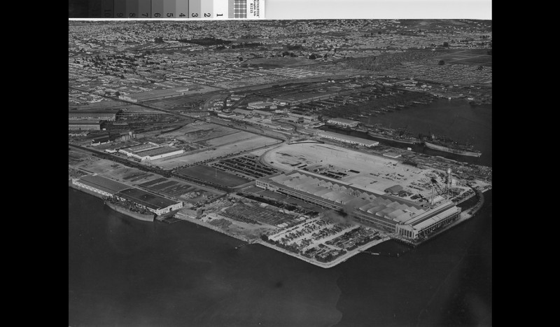 A 1940s aerial of the plant (center) and surrounding shipyards (Kaiser Yard 2 in background). Note the distinctive sawtooth monitors on the Assembly Plant's roof (Richmond Public Library).