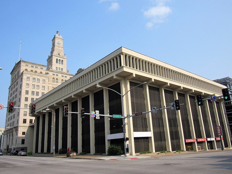 The parking structure was built in 1971 and was added to the bank building's National Register listing (as a boundary increase) in 2016.