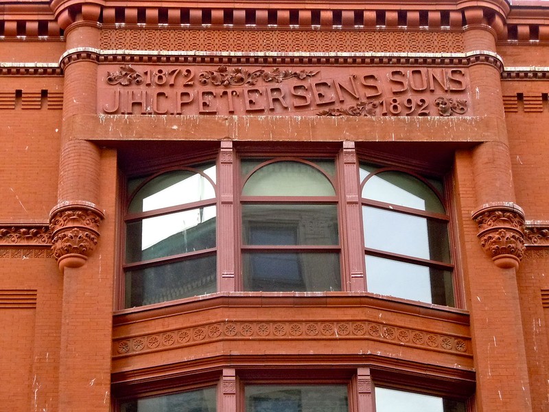 Closeup of the Petersen name on the building.