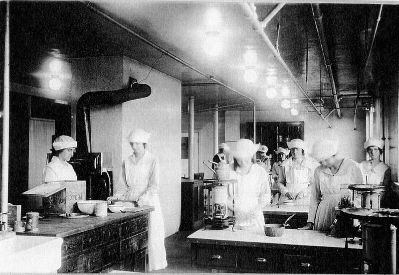 Students cook during a class in Virginia Hall's basement. 