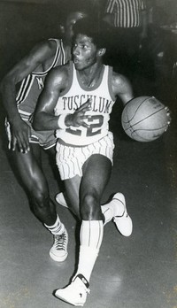 A basketball player in action in the old gymnasium