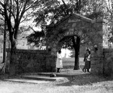 Students gathered under the arch.