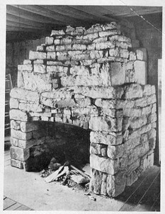 The front-room fireplace in the original Academy building.