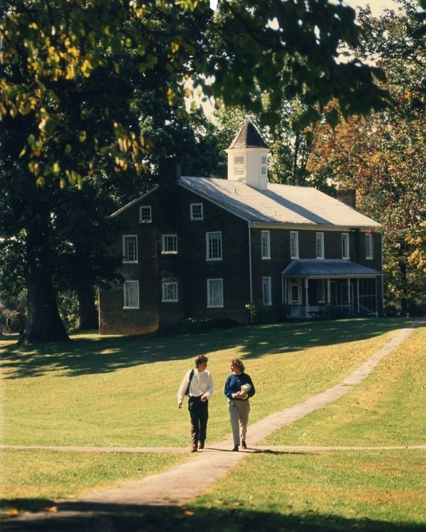 Students walk in front of Old College, 1980s-1990s