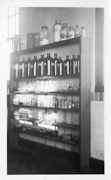 Chemical supply shelf in one of the labs in the Science Hall.