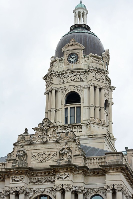 The tower has two levels and features four clocks and a large bell. 