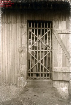 The photo shows some of Crazy Snake's members in jail.
https://www.okhistory.org/images/enc/CR004C.jpg