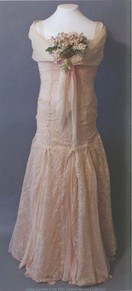 Merle Estelle Butcher O'Daniel (1939-1941) presented her inaugural gown to the collection herself. It is constructed of pink lace and sheer marquisette with fitted drop waist bodice and flaring skirt. Photo courtesy of the Woman's Collection, TWU.