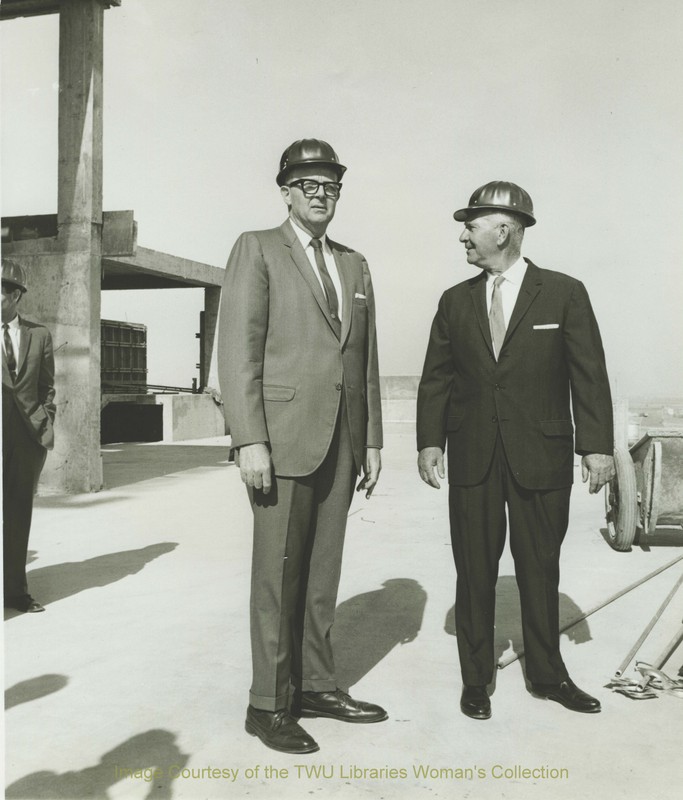 Dr. John A. Guinn and Denton mayor, Warren Whitson on top of Stark Hall during construction, Spring 1967. Courtesy of TWU Libraries.