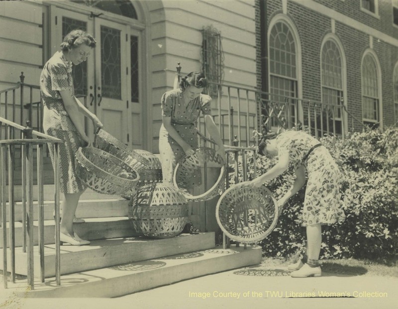 Dorothy LaSelle and students gathering the student-made light fixtures. Students working in the metal shop on campus cut and fabricated these fixtures as well as the altarpieces and metal trims within the Chapel.(Courtesy of TWU Woman's Collection)