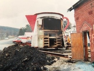 The Coffee Pot in a state of disrepair prior to the LHHC relocating it
and restoring it. Much of its wall was missing because of the building that was attached to the rear of it.

(The Lincoln Highway Heritage Corridor Archives)