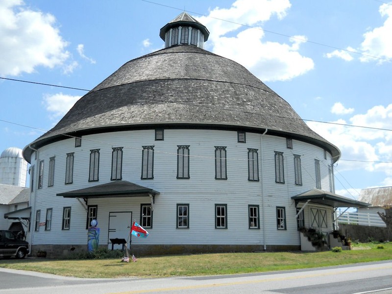 The round barn today is the perfect place to spend an afternoon to browse the shop and see the barn animals. (Roadside Wonders)