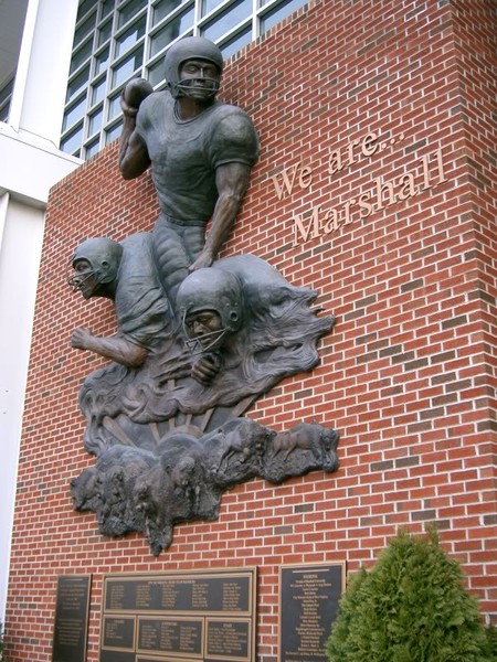 This bronze sculpture and plaques were installed in 2000 to honor members of the Thundering Herd who perished in the 1970 plane crash.