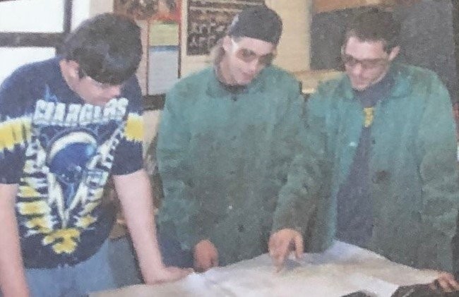 Here, the student who attended Somerset County Technology Center are looking the blueprint for the construction of roadside giant.