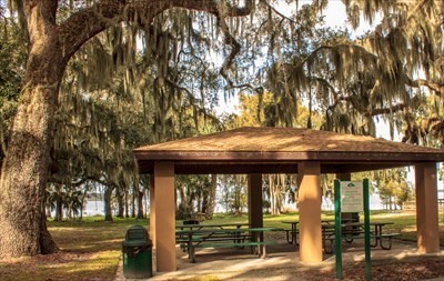 The Pavillion the shades the picnic tables in the center of the park